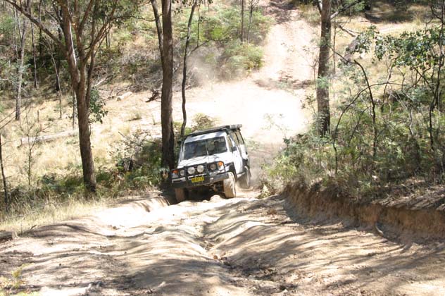 07-Plenty of dust flying as we head up the hill
