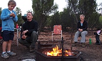 Peter toasts a marshmellow for Campbell with Fiona looking on