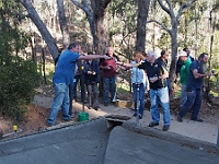 Greg pours Sally & Neil a celebratory glass of bubbly after the concrete pour