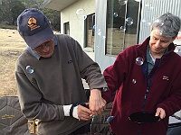 Laurie and Heidi cut the cake